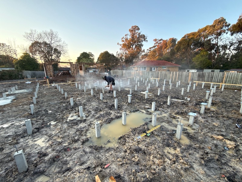Cleared Ringwood block after earthworks, with concrete stumps set out in rows