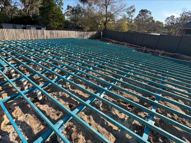 Treated subfloor joists laid across bearers on a Ringwood build