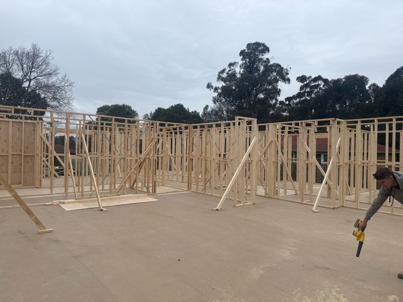 Timber wall frames standing on the new floor platform in Ringwood