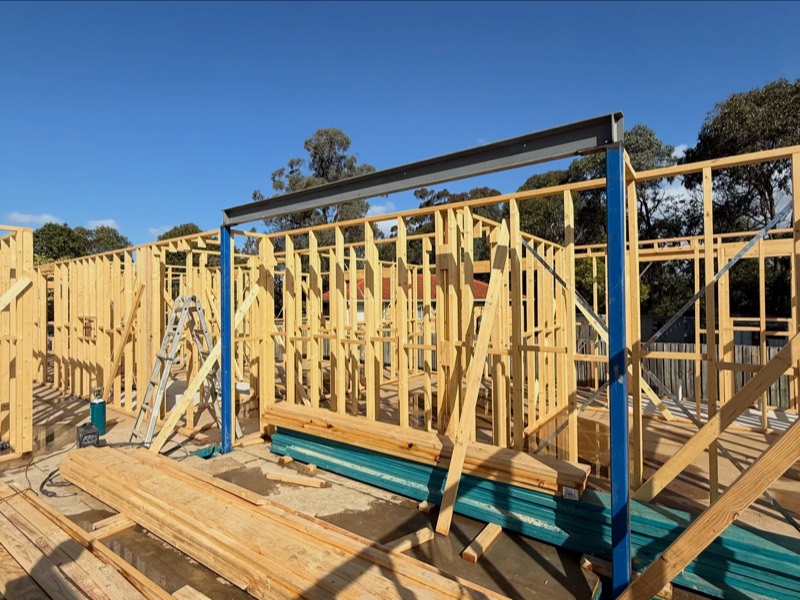 Blue structural steel beam set into new timber wall frames in Ringwood